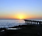 Sunrise over Hobie Pier as seen from Bluewaters Cafe